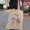 Sacoșă eco din bumbac gros, cu mânere lungi, fără inscripție, cu personajele Vivo și Viva.